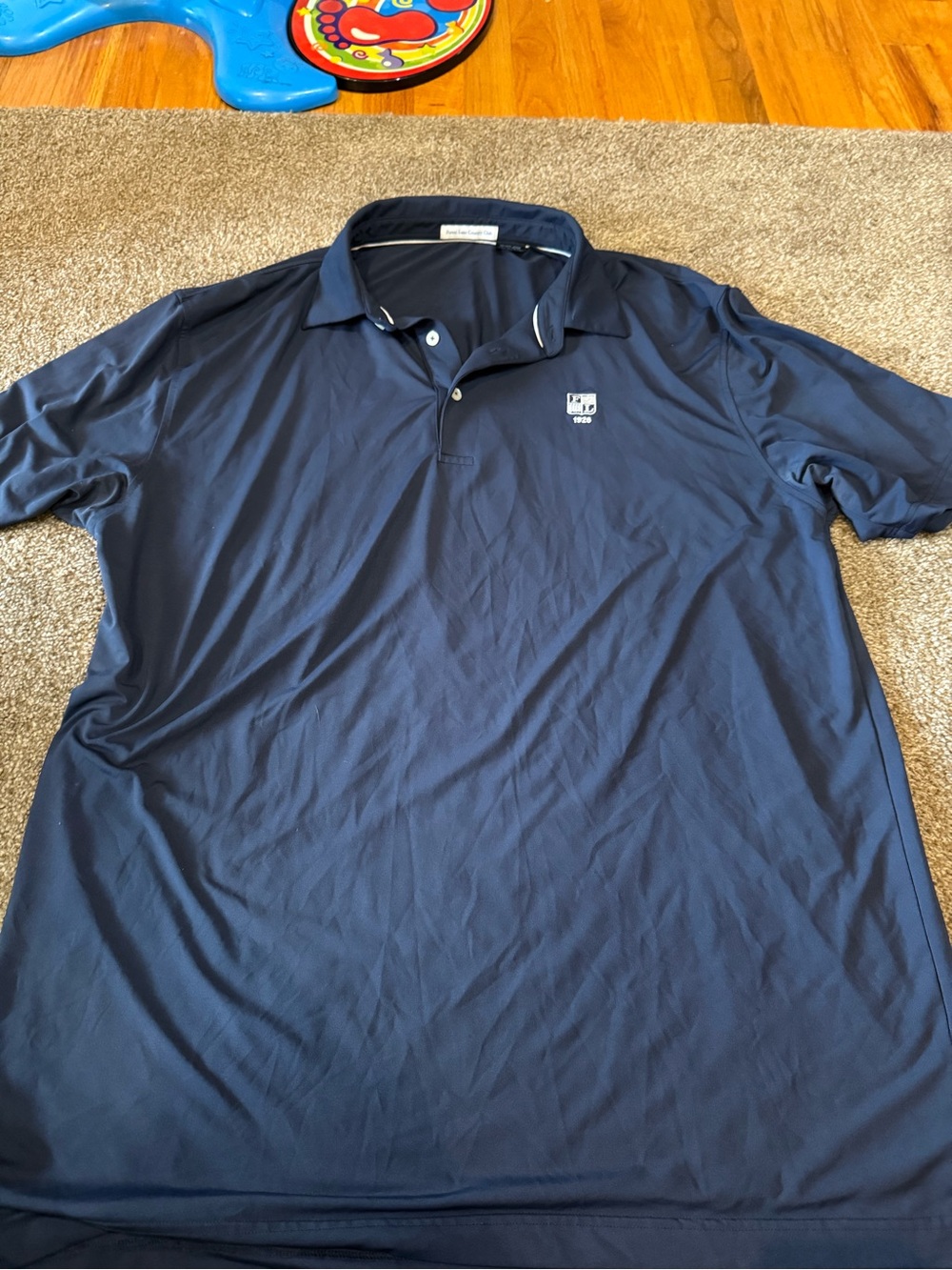 Men’s Navy Polo with White Chest Emblem